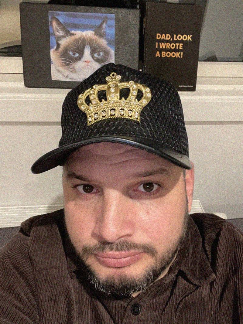 Abdel Seoud, the author, in a crown. The only copy is visible in the background.